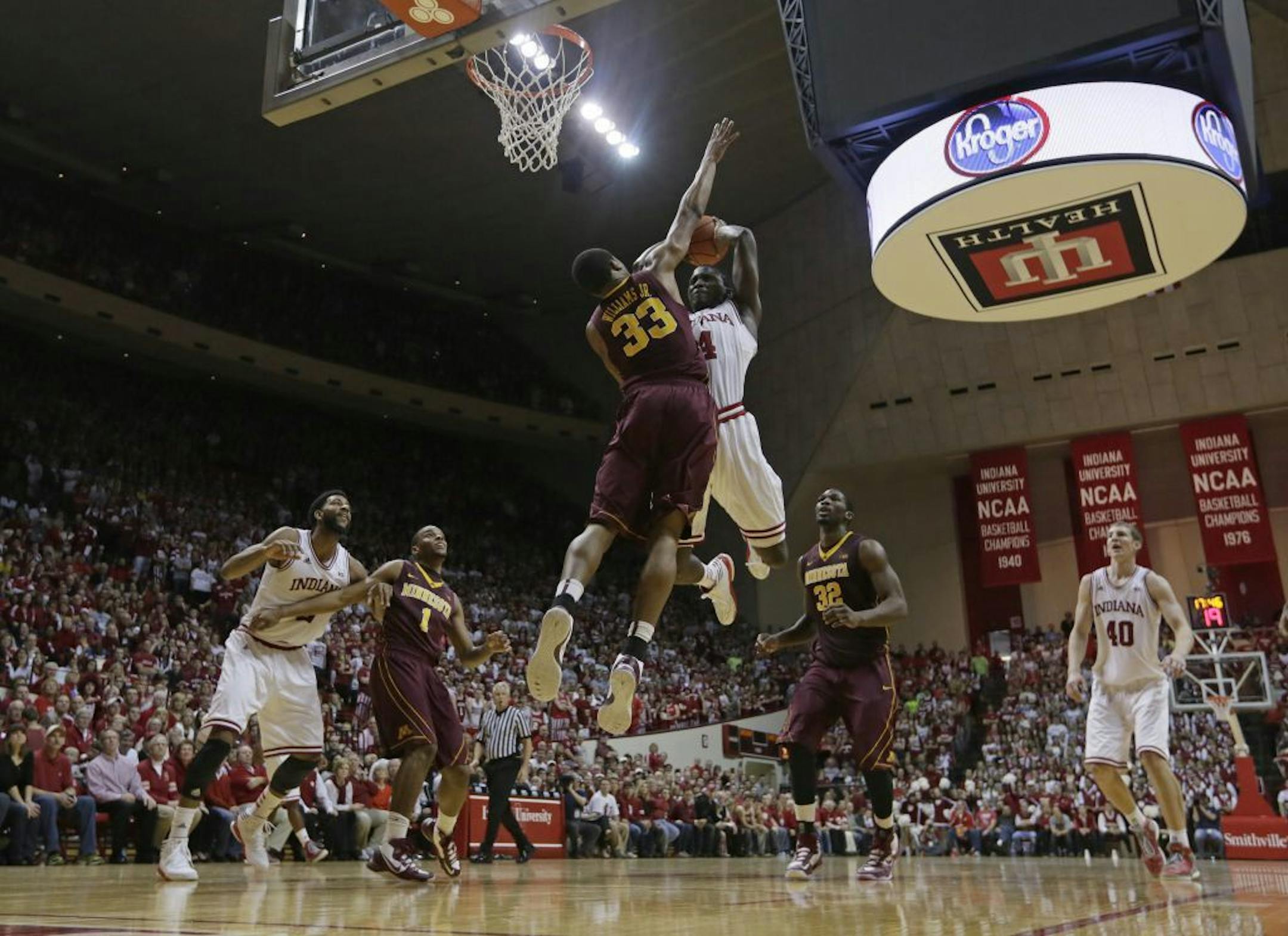 Indiana's Victor Oladipo (4) goes up for a dunk against Minnesota's Rodney Williams (33) during the second half of an NCAA college basketball game, Saturday, Jan. 12, 2013, in Bloomington, Ind. Indiana defeated Minnesota 88-81.