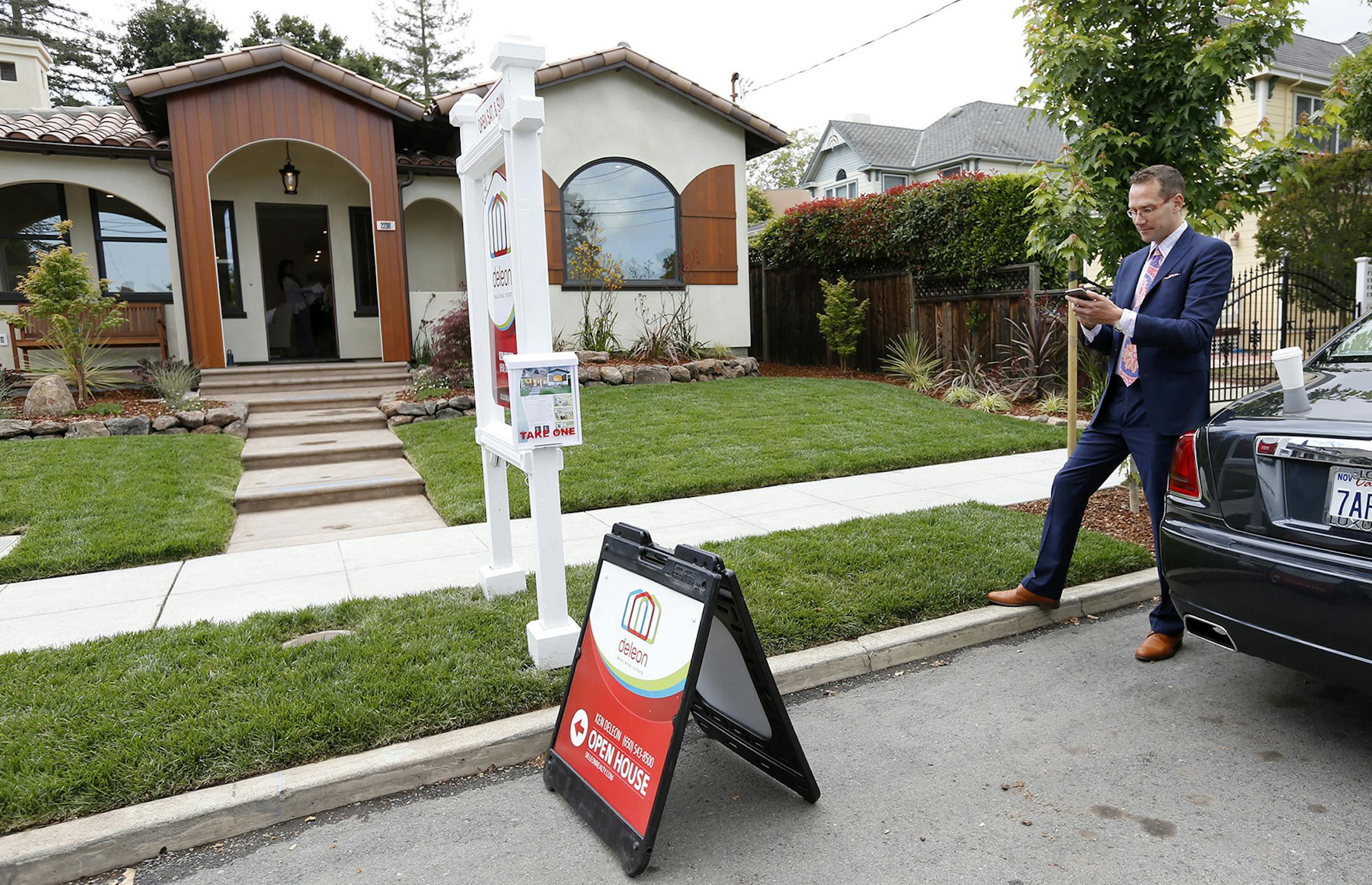 Ken DeLeon checks his phone messages during a brokers tour of a home he is selling in the College Terrace neighborhood on May 15, 2015 in Palo Alto, Calif. DeLeon, 42, is the founder of DeLeon Realty in Palo Alto. He is the top real estate agent in Silicon Valley and ranked as the number one real estate agent in the country. (Gary Reyes/Bay Area News Group/TNS) ORG XMIT: 1169509