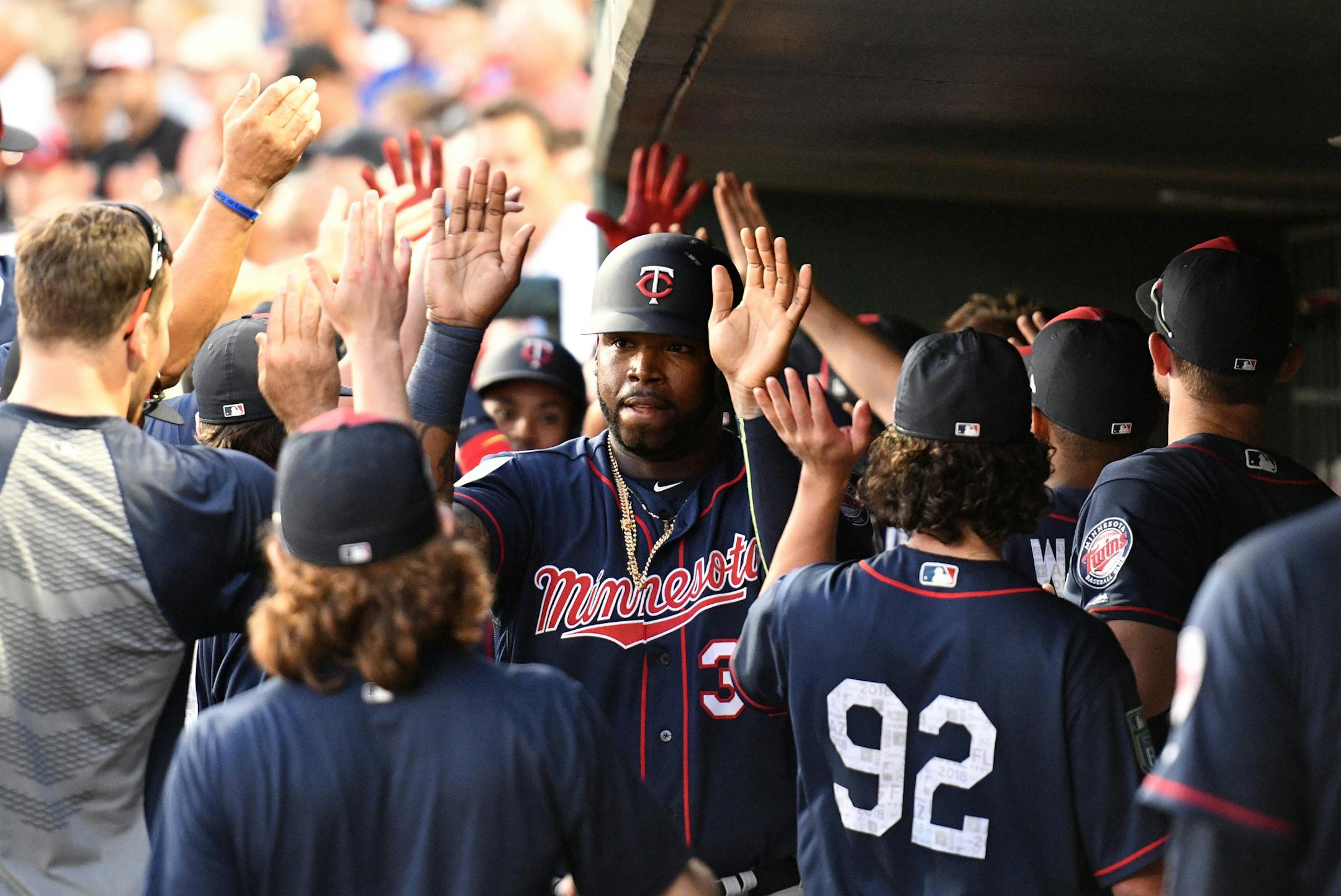 Twins first baseman Kennys Vargas (30) celebrated with teammates after scoring the Twins first run on the second inning. ] MARK VANCLEAVE ï mark.vancleave@startribune.com * The Minnesota Twins played the Baltimore Orioles at Ed Smith Stadium in Sarasota, Florida on Saturday, Feb. 24, 2018.