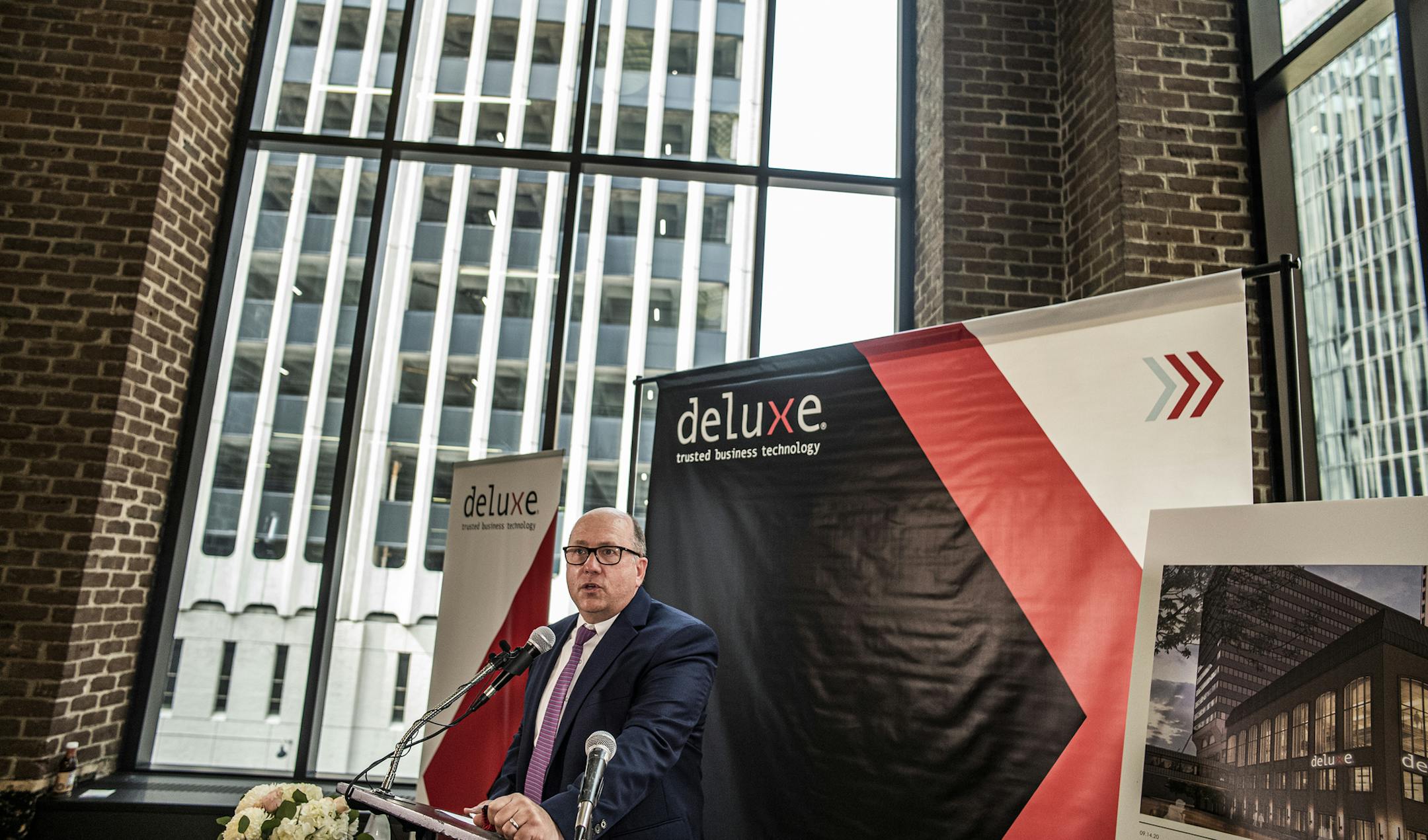 Deluxe CEO Barry McCarthy was pleased to announce the company's move to downtown Minneapolis.] Deluxe announcing it is moving headquarters to downtown Minneapolis also Deluxe has agreed to open a new financial technology center that will employ more than 700 north of Atlanta. RICHARD TSONG-TAATARII ¥ richard.tsong-taatarii@startribune.com