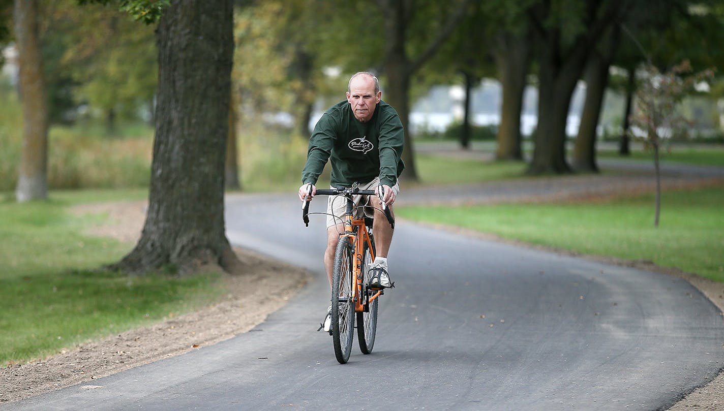 Steve Cook, former Hutchinson mayor, rode his bike on the upgraded Luce Line Trail which has now been paved between Hutchinson and Winsted and some parts overlook the Crow River, Tuesday, October 6, 2015 in Hutchinson, MN. ] (ELIZABETH FLORES/STAR TRIBUNE) ELIZABETH FLORES &#x2022; eflores@startribune.com