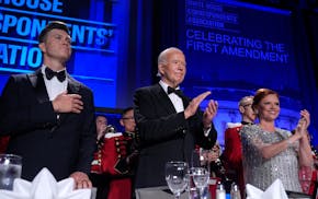 Host Colin Jost, from left, President Joe Biden and Kelly O'Donnell, WHCA vice president and Senior White House correspondent for NBC News, stand duri