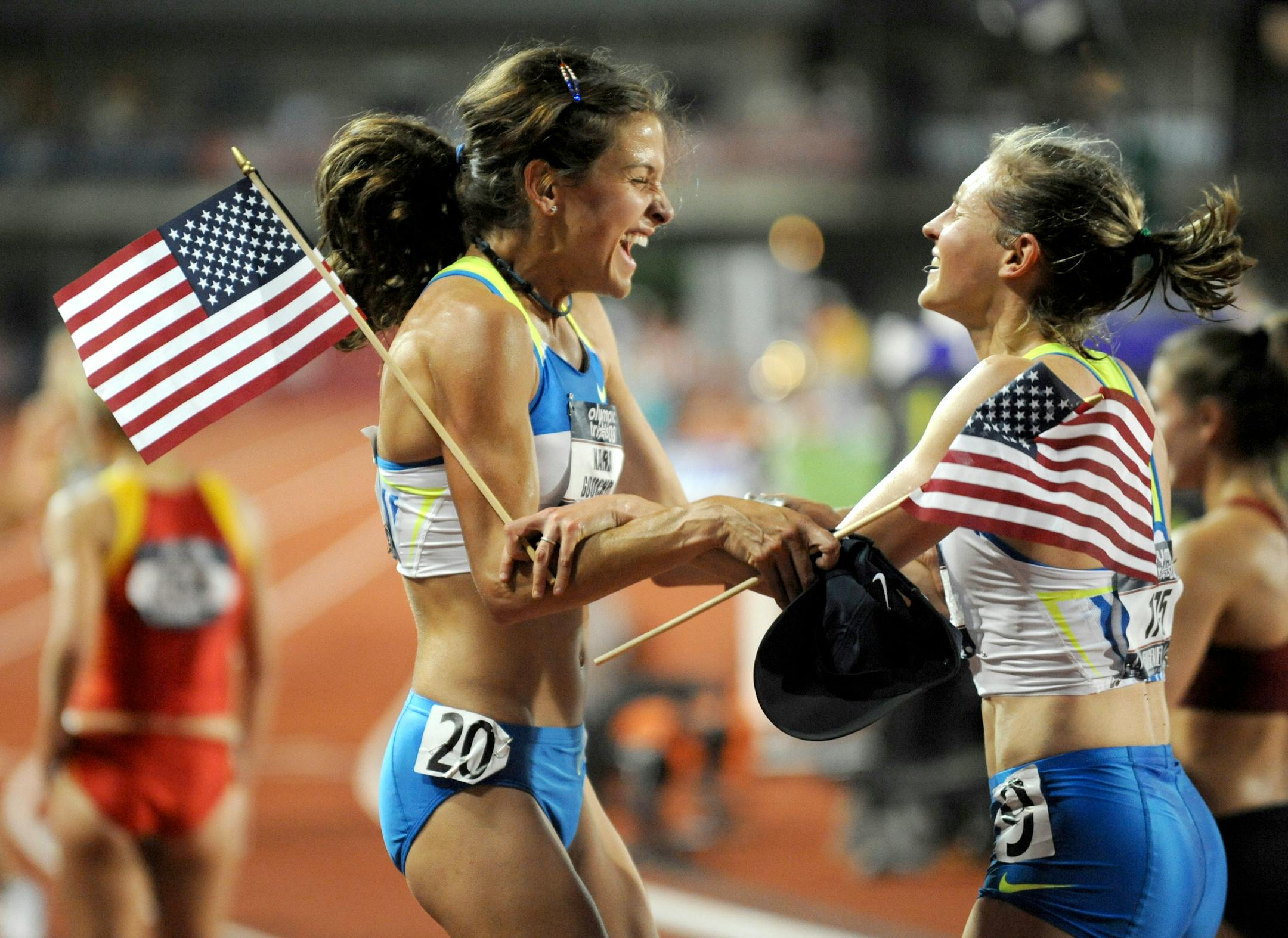Kara Goucher and Amy Begley (right) celebrate making the Olympic team after finishing second and third in the 10,000 meter run during the U.S. Olympic Track and Field Trials in Eugene Oregon, Saturday, June 28, 2008.