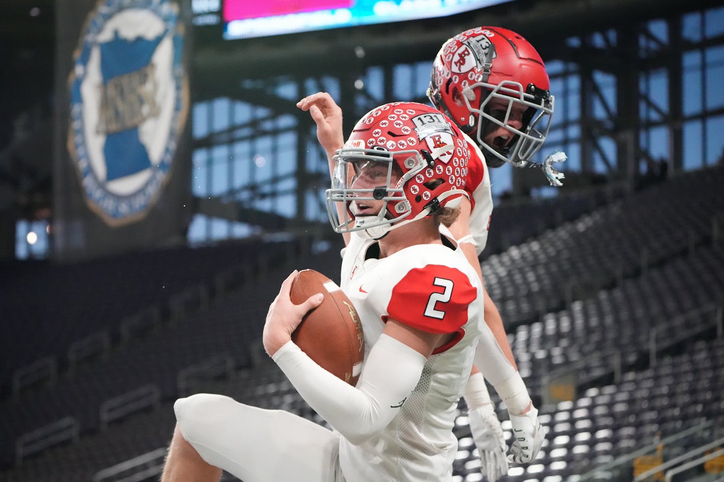 Elk River's Cade Osterman (2) celebrates with teammate Caleb Sandstrom (8) after scoring a touchdown in the first half of the Minnesota High School football Class 5A State Championship at U.S. Bank Stadium in Minneapolis, Minn., on Saturday, Dec. 3, 2022. ] SHARI L. GROSS • shari.gross@startribune.com