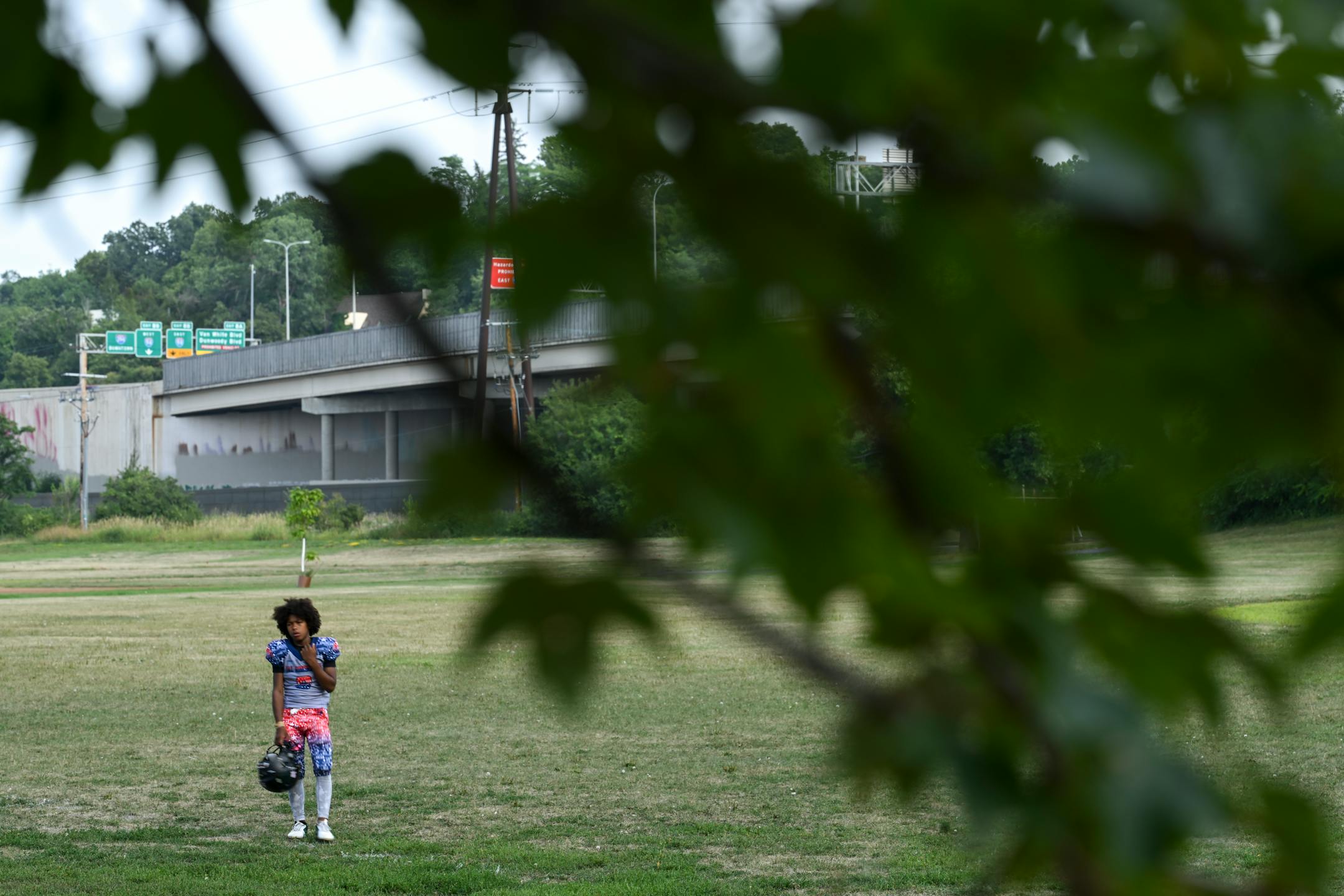 A Minnesota Jays youth football player waits for practice to start at Bryn Mawr Meadows Park.