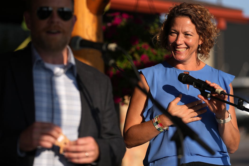 Duluth Mayor Emily Larson and Superior, Wis., Mayor Jim Paine spoke during a community block party held by Duluth Grill owner Tom Hanson in Lincoln Park last month.