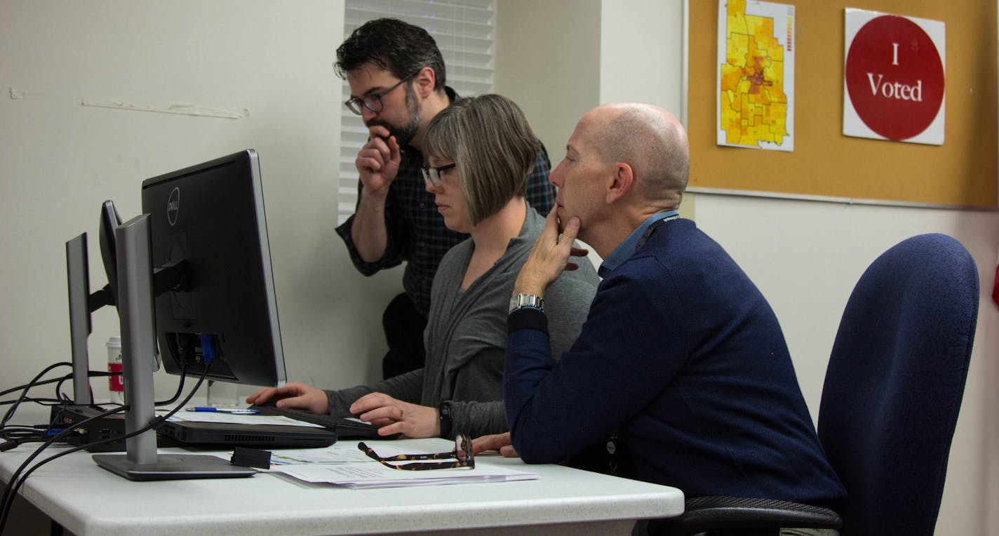 Tabulators examine data from ballots cast in the Minneapolis mayoral race on Wednesday, November 8, 2017.