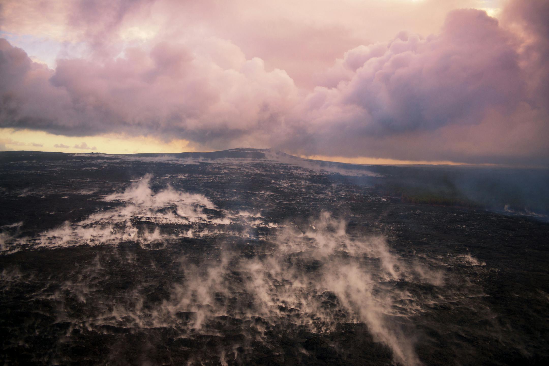 In this aerial shot, taken in Sept. 2015, a steaming surface reflects hot lava beneath. Island of Hawaii Visitors Bureau (IHVB) / Tyler Schmitt