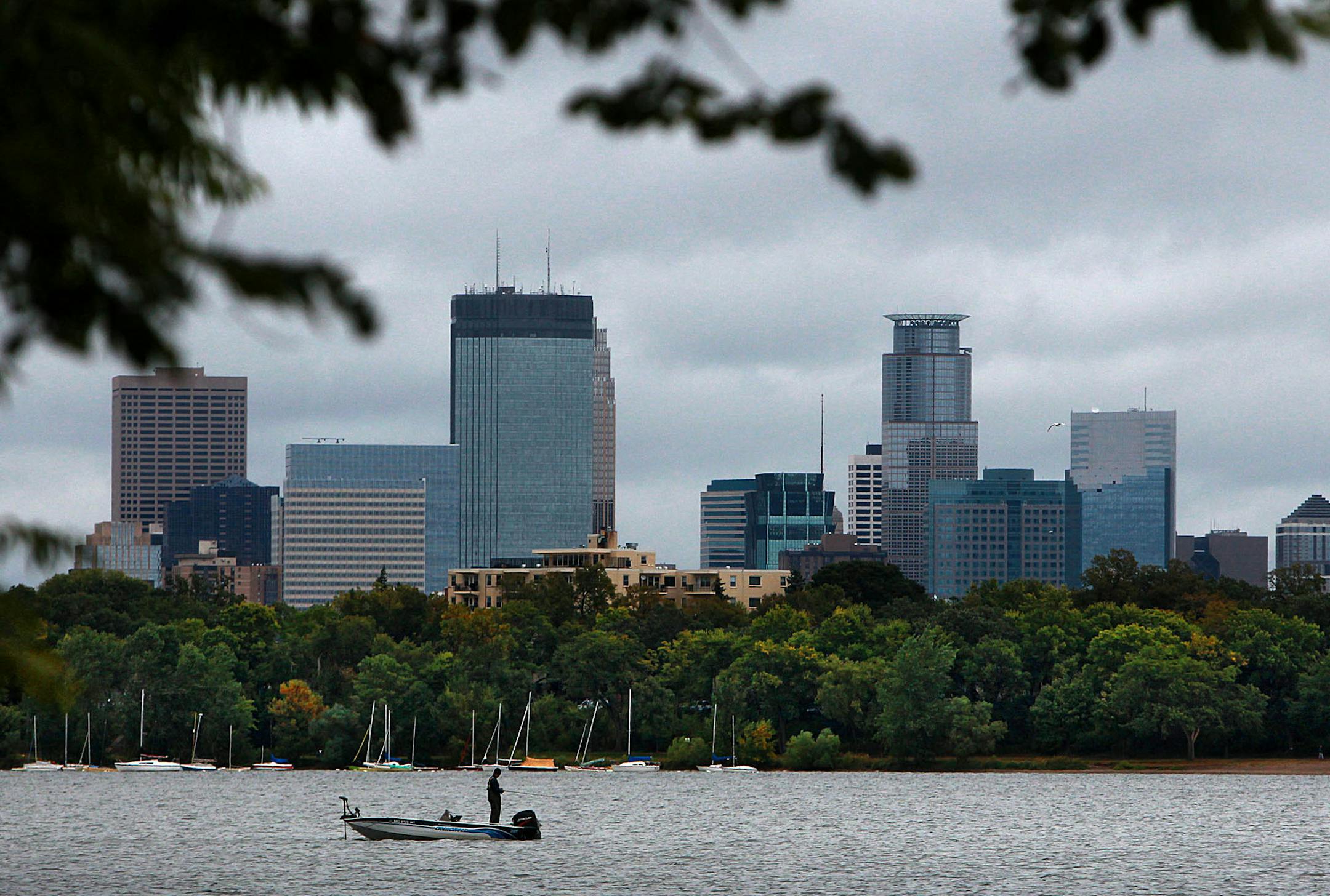 A fall approaches, a fisherman tried his luck in the chilly waters of Lake Calhoun, in the shadow of the downtown Minneapolis skyline. ] JIM GEHRZ‚Ä¢jgehrz@startribune.com (JIM GEHRZ/STAR TRIBUNE) / September 21, 2011/1:00 PM ,Minneapolis MN**