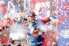 Jimmie Johnson celebrated a win in victory lane at the Auto Club 400 NASCAR Sprint Cup Series race in Fontana, Calif., on Sunday.