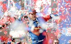 Jimmie Johnson celebrated a win in victory lane at the Auto Club 400 NASCAR Sprint Cup Series race in Fontana, Calif., on Sunday.