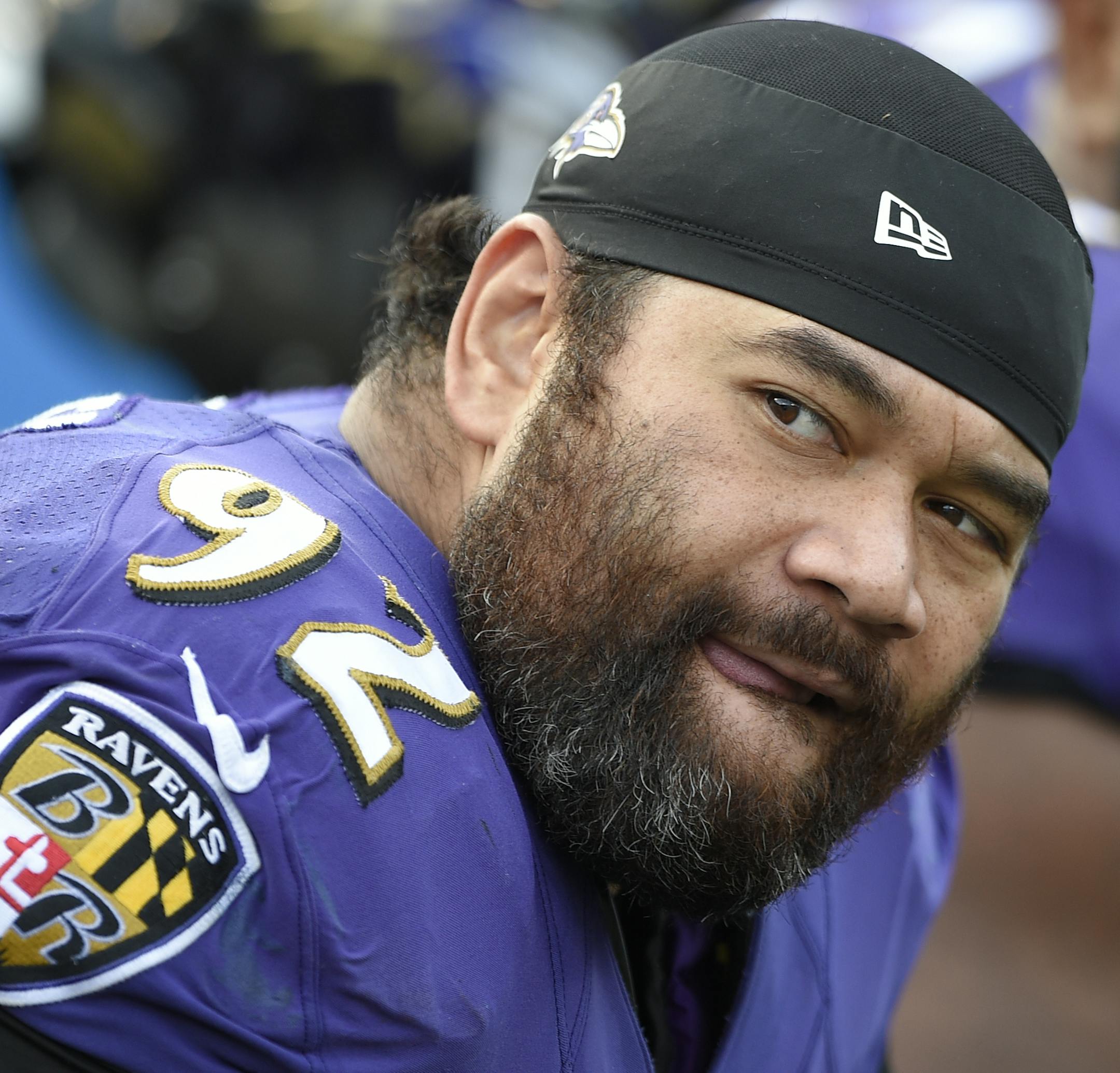 FILE - In this Nov. 9, 2014, file photo, Baltimore Ravens defensive end Haloti Ngata watches the action from the sidelines during the second half of an NFL football game against the Tennessee Titans in Baltimore. Ngata and the Ravens can only hope that a four-week suspension won't hinder his effectiveness in Saturday night's playoff game against the Pittsburgh Steelers. (AP Photo/Nick Wass, File) ORG XMIT: NY156