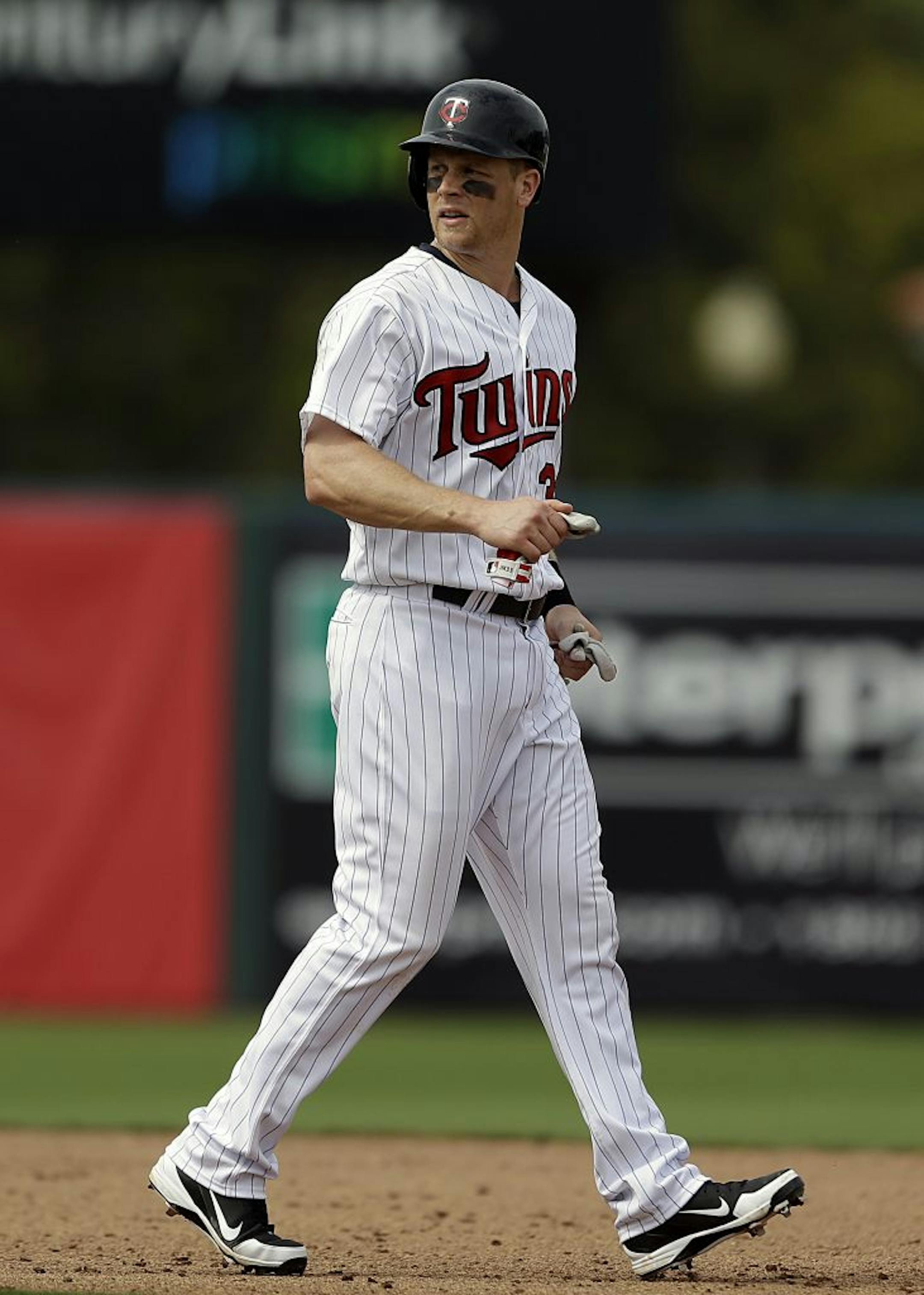 Minnesota Twins' Justin Morneau hits a double to score three runs in the fourth inning of an exhibition spring training baseball game against the Pittsburgh Pirates, Monday, Feb. 25, 2013, Fort Myers, Fla.