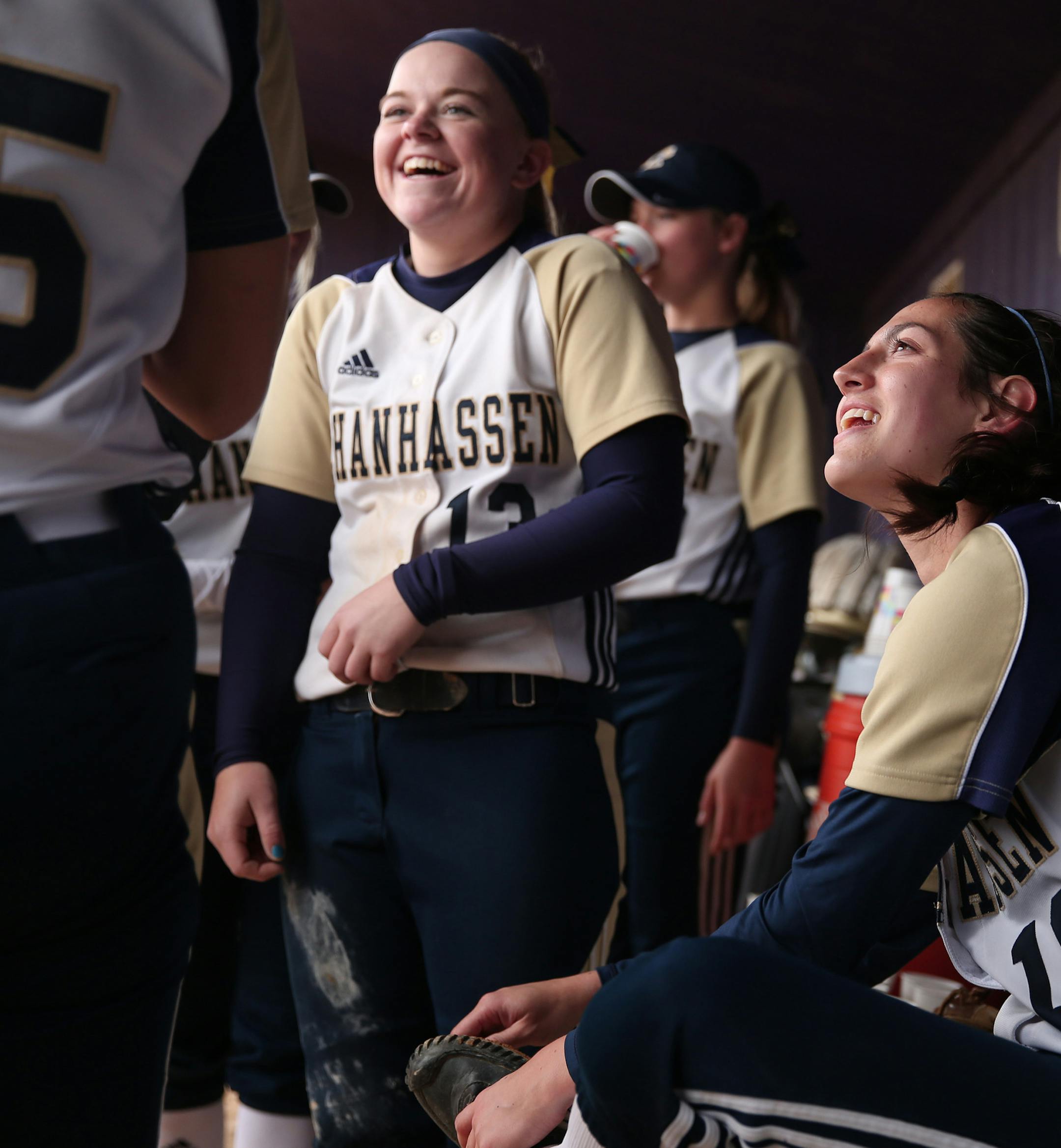 Taylor Manno joked with her teammates as she cleaned mud from her cleats Thursday. ] ANTHONY SOUFFLE ï anthony.souffle@startribune.com Chanhassen softball player Taylor Manno played in a softball game Thursday, May 18, 2017 in Chaska, Minn. Manno, one of the state's top pitchers who will play at Rutgers, has endured this season while coping with the death of her father, who also was a presence on the team.