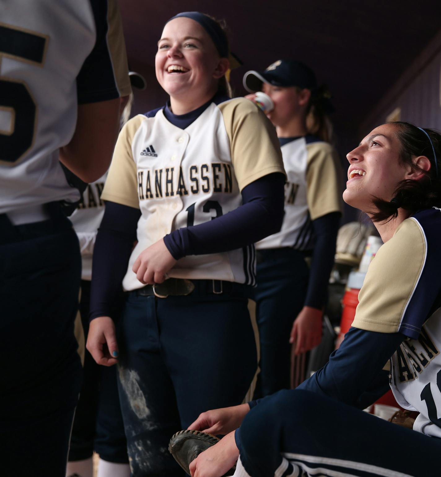 Taylor Manno joked with her teammates as she cleaned mud from her cleats Thursday. ] ANTHONY SOUFFLE &#xef; anthony.souffle@startribune.com Chanhassen softball player Taylor Manno played in a softball game Thursday, May 18, 2017 in Chaska, Minn. Manno, one of the state's top pitchers who will play at Rutgers, has endured this season while coping with the death of her father, who also was a presence on the team.