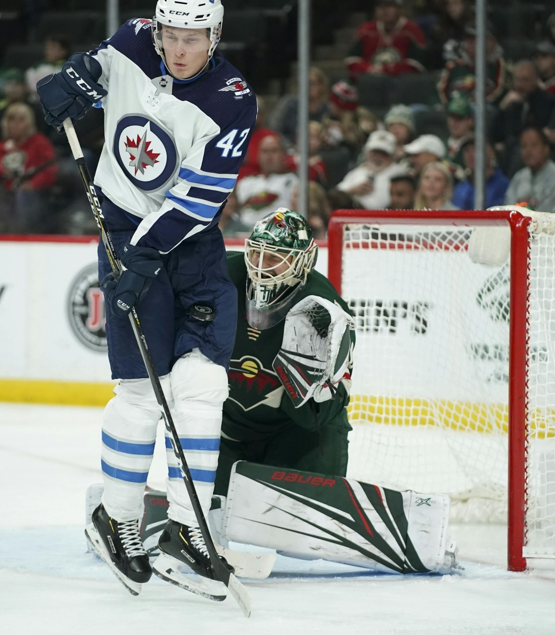 Winnipeg Jets left wing Kristian Vesalainen (42) was hit with a second period shot while screening Minnesota Wild goaltender Devan Dubnyk.