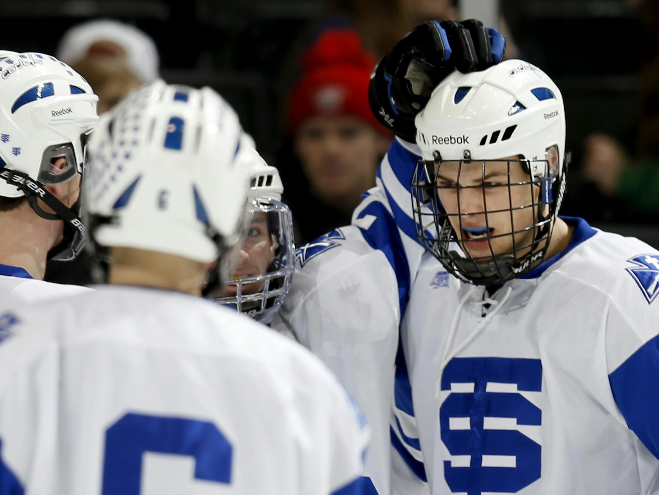 St. Thomas Academy celebrated a goal by Jake Geiser (right) in the second period.