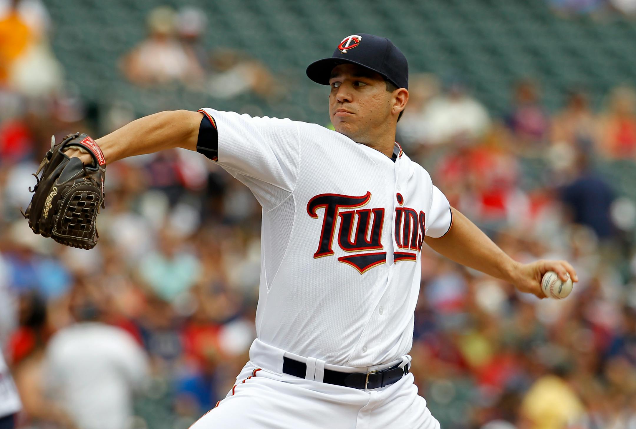 Minnesota Twins starting pitcher Tommy Milone delivers to the Cleveland Indians during the first inning of a baseball game in Minneapolis, Sunday, Aug. 16, 2015. (AP Photo/Ann Heisenfelt)