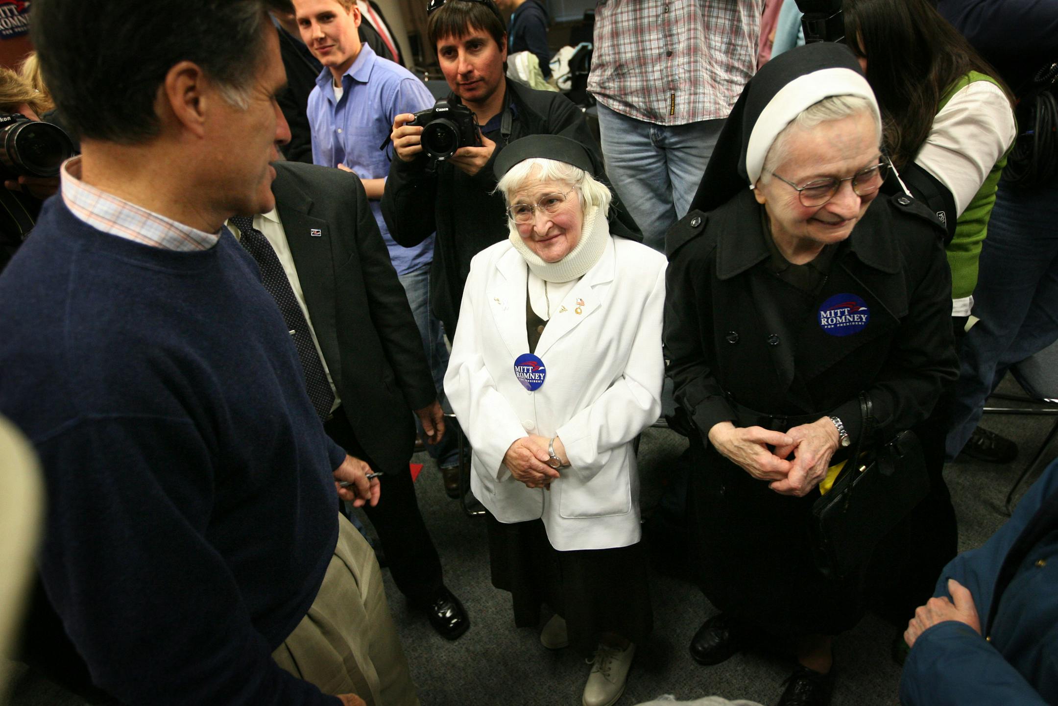 Potential voters, Sisters Blanche Marie Haag (L) and Lucilla Oberbroeckling from Mount St. Francis Convent, get a chance to speak to Republican presidential hopeful Mitt Romney as he campaigns at Loras College in Dubuque, Iowa.