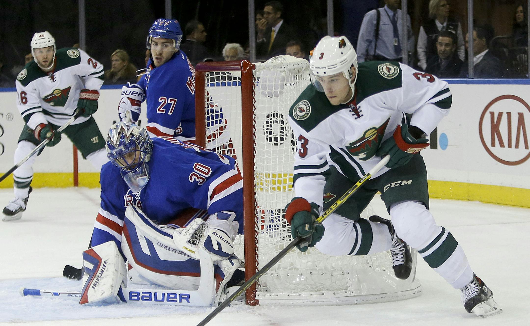 Rangers goalie Henrik Lundqvist kept an eye on Wild winger Charlie Coyle as he circled the net during the first period of New York's 5-4 victory Monday.