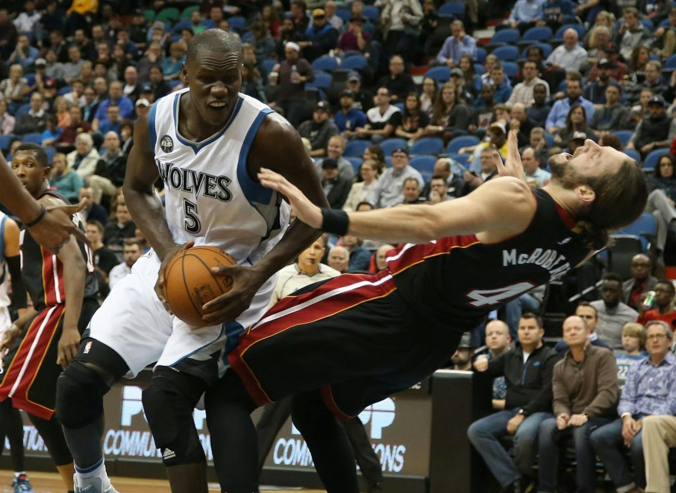 Wolves Gorgui Dieng got called for the offensive foul against Miami's Josh McRoberts during the first half.
