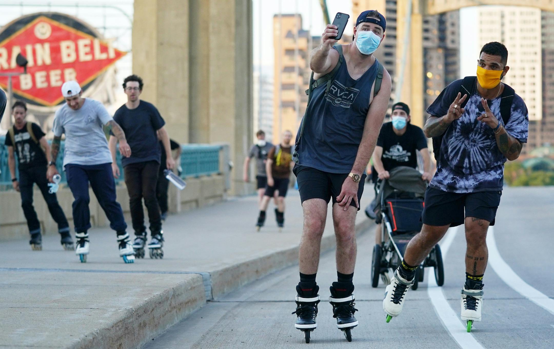 Rollerbladers including Shane McClay, right, skated over the Hennepin Avenue Bridge on a friendly outing from BF Nelson Park to Loring Park. ] ANTHONY SOUFFLE • anthony.souffle@startribune.com A group of about 20 rollerbladers got together for a 10-mile skate together from BF Nelson Park to Loring Park Friday, July 24, 2020 in Minneapolis. Rollerblading/inline skating was invented in Minnesota, but after peaking in the late 1990s and early 2000s, the sport fell out of favor with most.