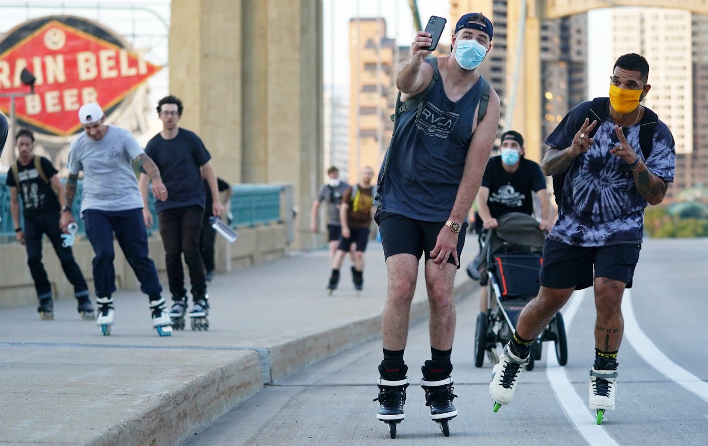 Rollerbladers including Shane McClay, right, skated over the Hennepin Avenue Bridge on a friendly outing from BF Nelson Park to Loring Park. ] ANTHONY SOUFFLE • anthony.souffle@startribune.com A group of about 20 rollerbladers got together for a 10-mile skate together from BF Nelson Park to Loring Park Friday, July 24, 2020 in Minneapolis. Rollerblading/inline skating was invented in Minnesota, but after peaking in the late 1990s and early 2000s, the sport fell out of favor with most.