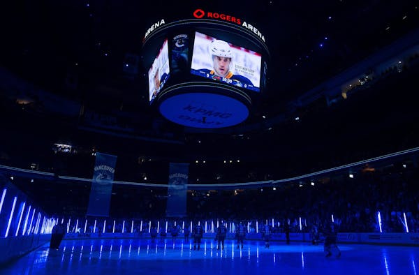 Wild and Canucks players stood for a moment of silence Monday night in memory of Vancouver-born former NHL player Steve Montador, 35, who was found de