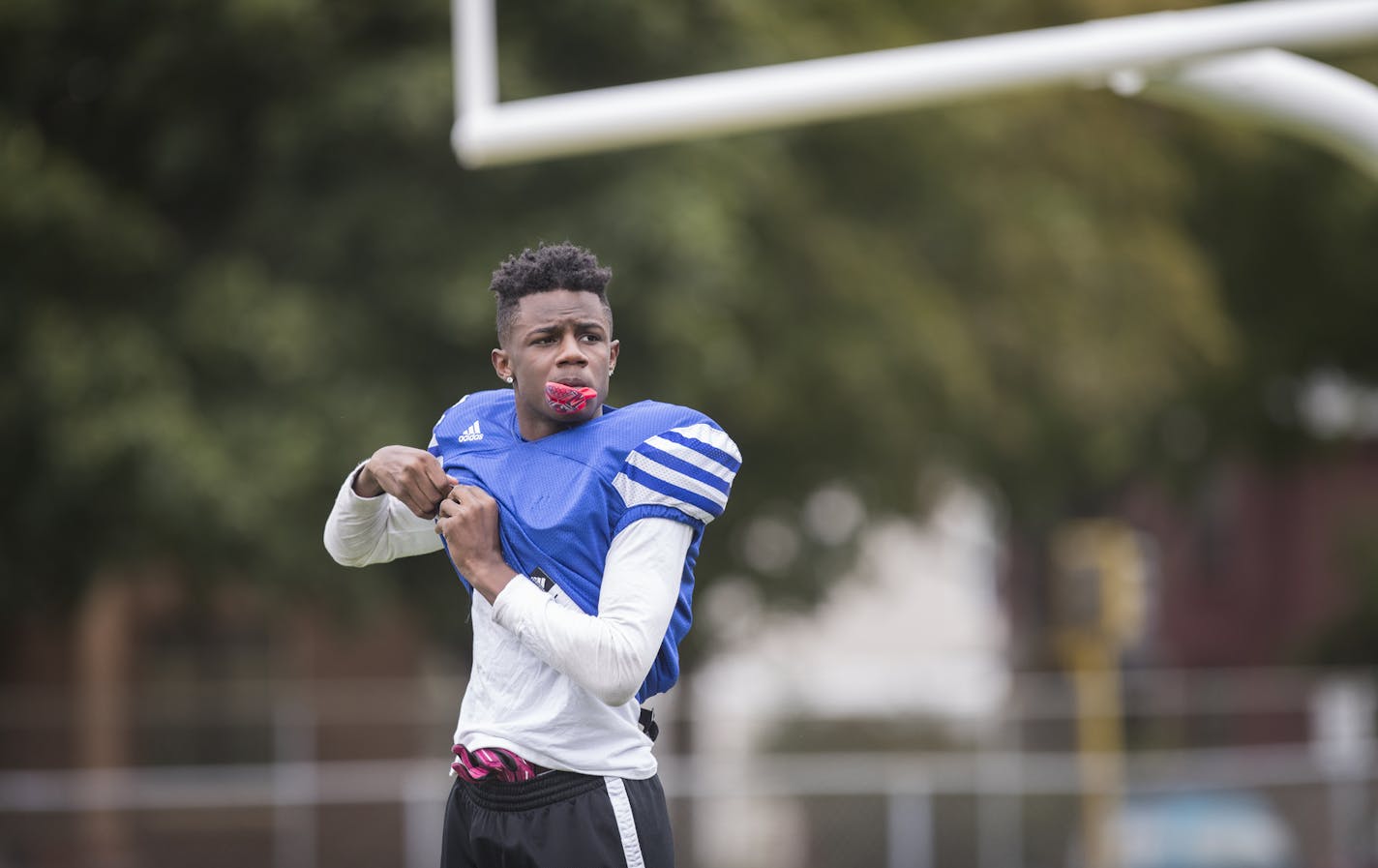 Tayler Johnson suits up for practice. ] (Leila Navidi/Star Tribune) leila.navidi@startribune.com BACKGROUND INFORMATION: Football practice at North High School in Minneapolis on Wednesday, September 28, 2016. Feature on Minneapolis city football conference rivalries fading under the new district scheduling arrangement.