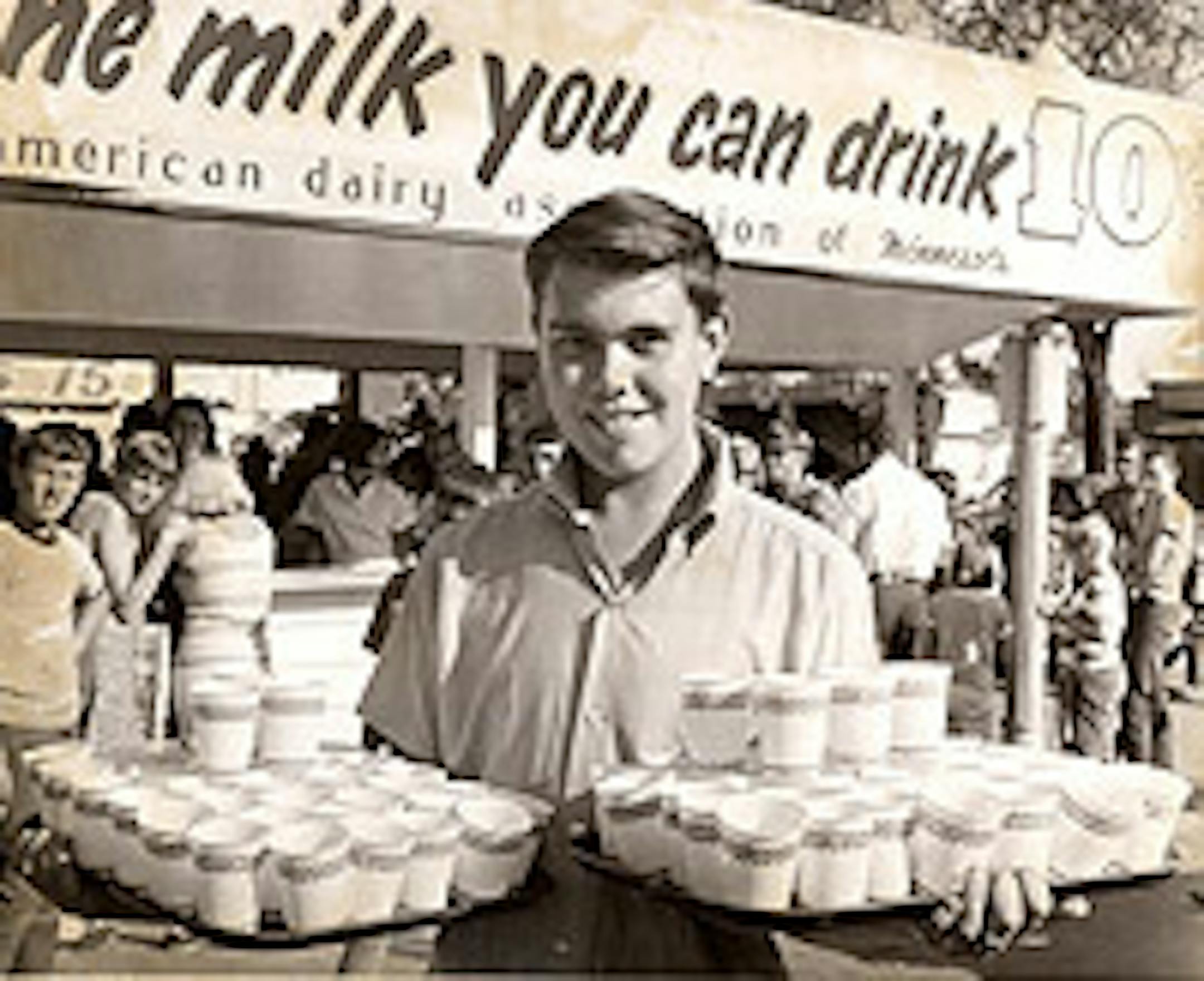 John Johnson, 16, broke his own all-time record by drinking 76 six-ounce cups of milk in one hour at the American Dairy Association stand at the 1967 State Fair.