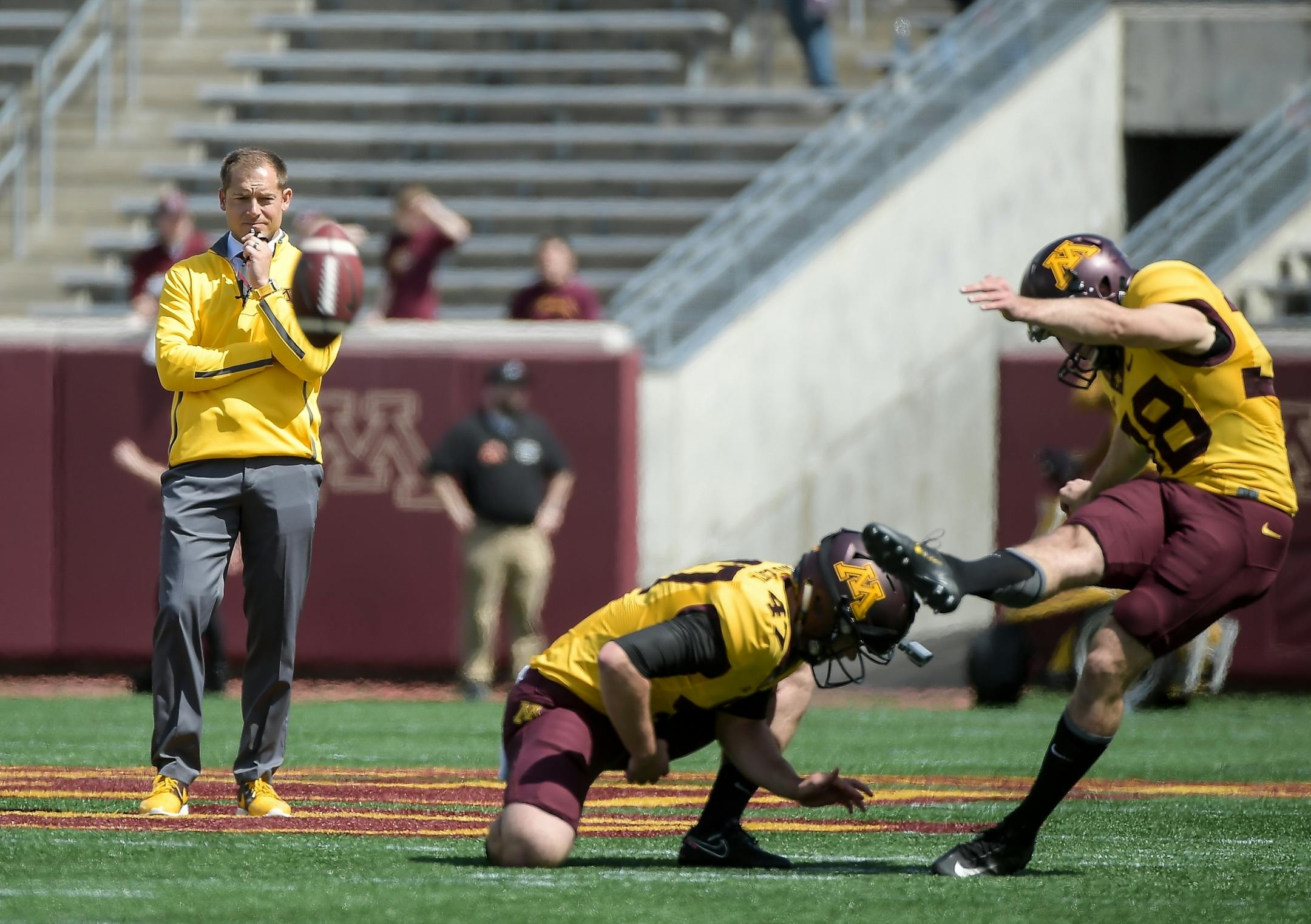 Gophers football coach P.J. Fleck watched kicker Emmit Carpenter as he practiced field goals at the end of Saturday's spring game.