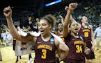 Minnesota's Destiny Pitts, Kenisha Bell, Gadiva Hubbard and Jessie Edwards, from left, celebrate the team's first-round win over Green Bay in the NCAA