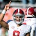 FILE - Alabama quarterback Bryce Young (9) during warm ups before the start of an NCAA college football game against Auburn on Nov. 27, 2021, in Aubur