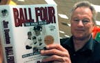 Former major league pitcher Jim Bouton signs copies of his book, "Ball Four: The Final Pitch," on November 27, 2000, in Schaumburg, Ill.