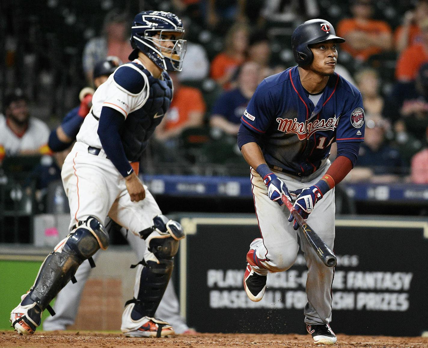 Minnesota Twins' Jorge Polanco, right, watches his two-run home run off Houston Astros relief pitcher Chris Devenski during the eighth inning of a baseball game, Monday, April 22, 2019, in Houston. (AP Photo/Eric Christian Smith) ORG XMIT: MER765e26fc442f29d558a2957b29fd8