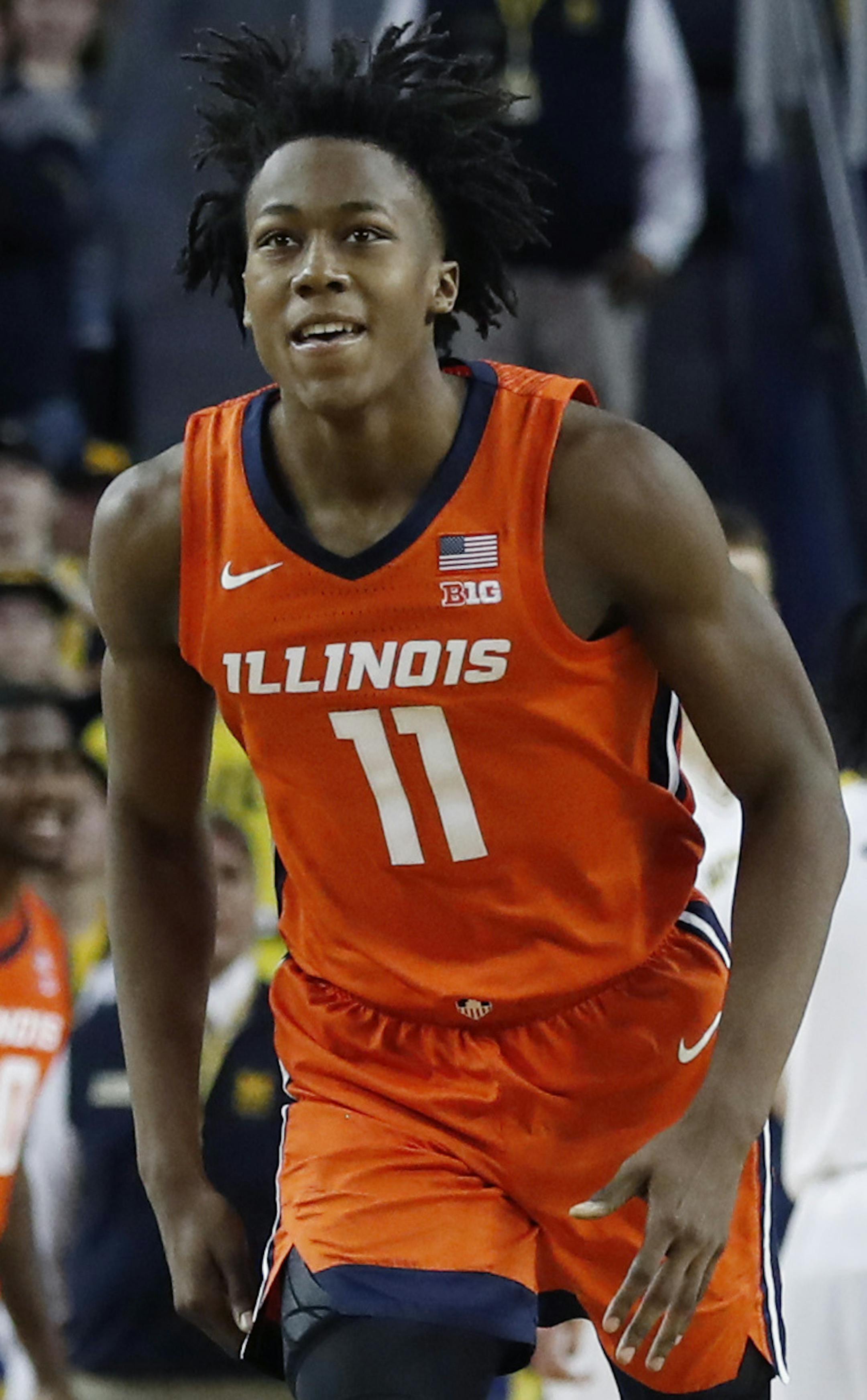Illinois guard Ayo Dosunmu (11) runs up court after hitting the go-ahead score with less than second remaining during the second half of an NCAA college basketball game against Michigan, Saturday, Jan. 25, 2020, in Ann Arbor, Mich. (AP Photo/Carlos Osorio)