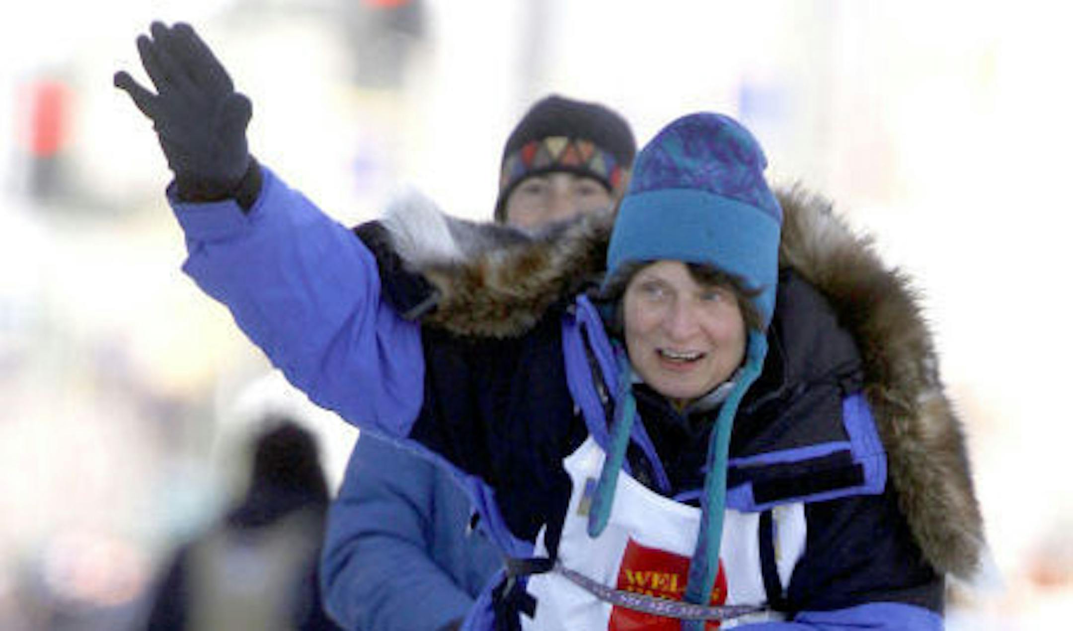 Cindy Gallea drives her team down Fourth Avenue in Anchorage, Alaska, during the ceremonial start of the Iditarod Trail Sled Dog Race on Saturday, March 7, 2009.