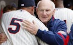 Michael Cuddyer hugged Hall of Famer and Twins legend Harmon Killebrew before the 2010 home opener, which was the first game played at Target Field.