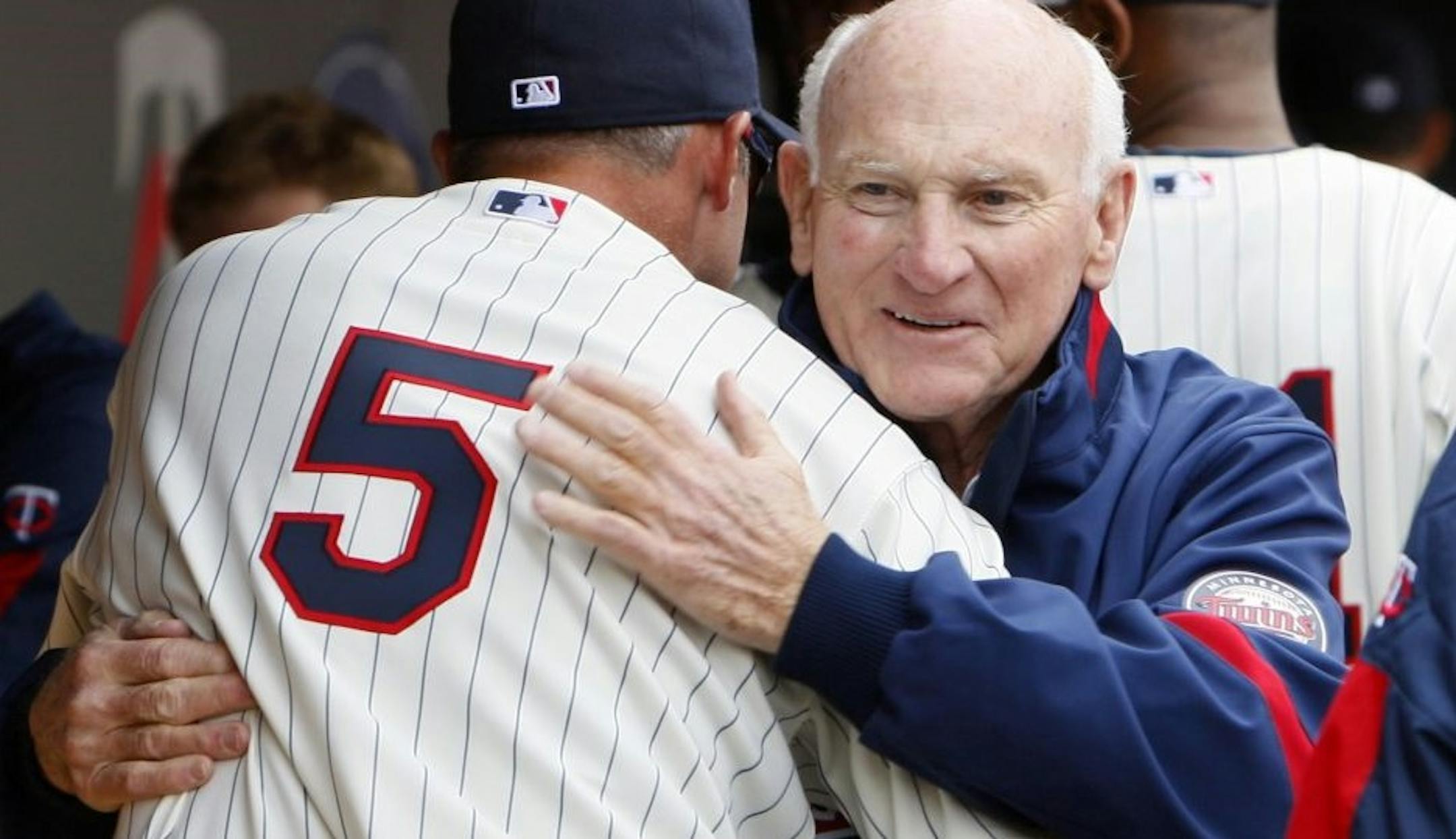 Michael Cuddyer hugged Hall of Famer and Twins legend Harmon Killebrew before the 2010 home opener, which was the first game played at Target Field.