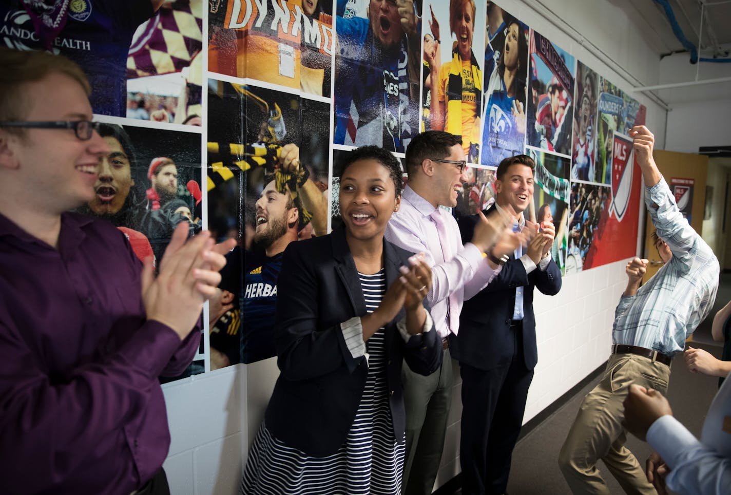 From the left; Brandon Jones Zoe Haynes, Chris Martinez, and Anthony Nahill cheered for Ryan Kastenschmidt who was pretending to shoot a bow and arrow during a sports-like warm up routine the trainees do each morning to motivate each other at the Major League Soccer (MLS) national sales center on August 7, 2017 in Blaine, Minn. ] RENEE JONES SCHNEIDER � renee.jones@startribune.com