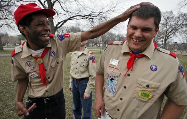 Troop 154 from Eagan is made up entirely of developmentally disabled adults, ages 31-52. Airon Hayes, left and Shawn Herron shared a joke at a recent 