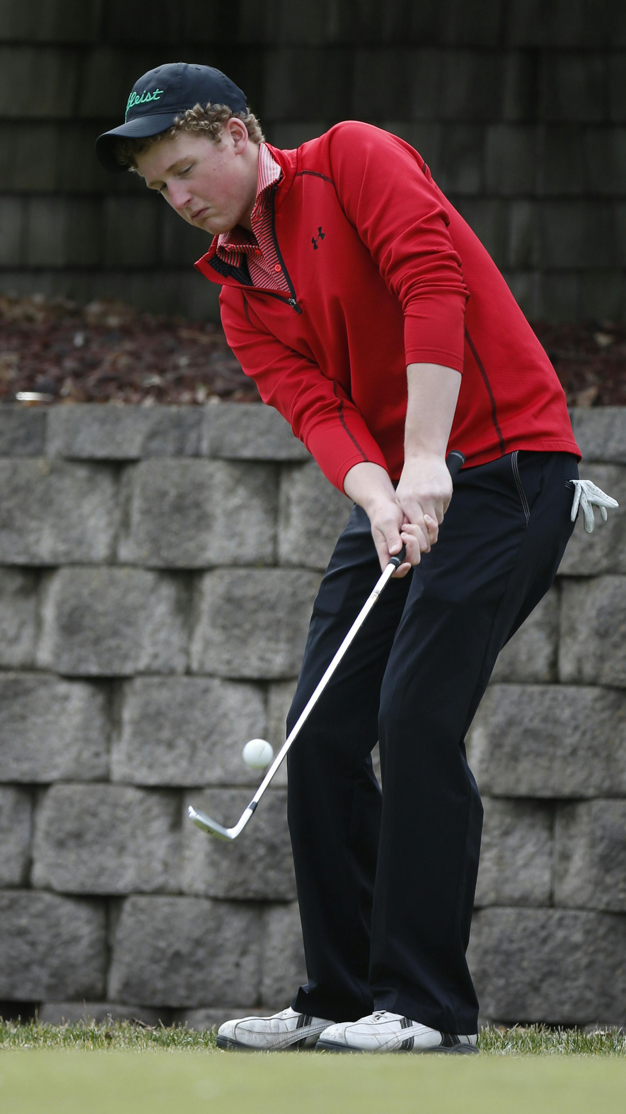 Connor Isaacson chipped as he and other players ran drills to work on their short game. ] (KYNDELL HARKNESS/STAR TRIBUNE) kyndell.harkness@startribune.com During Mounds View's golf practice at Gross National Golf Course in St. Anthony Village Min., Friday, April 10, 2014.