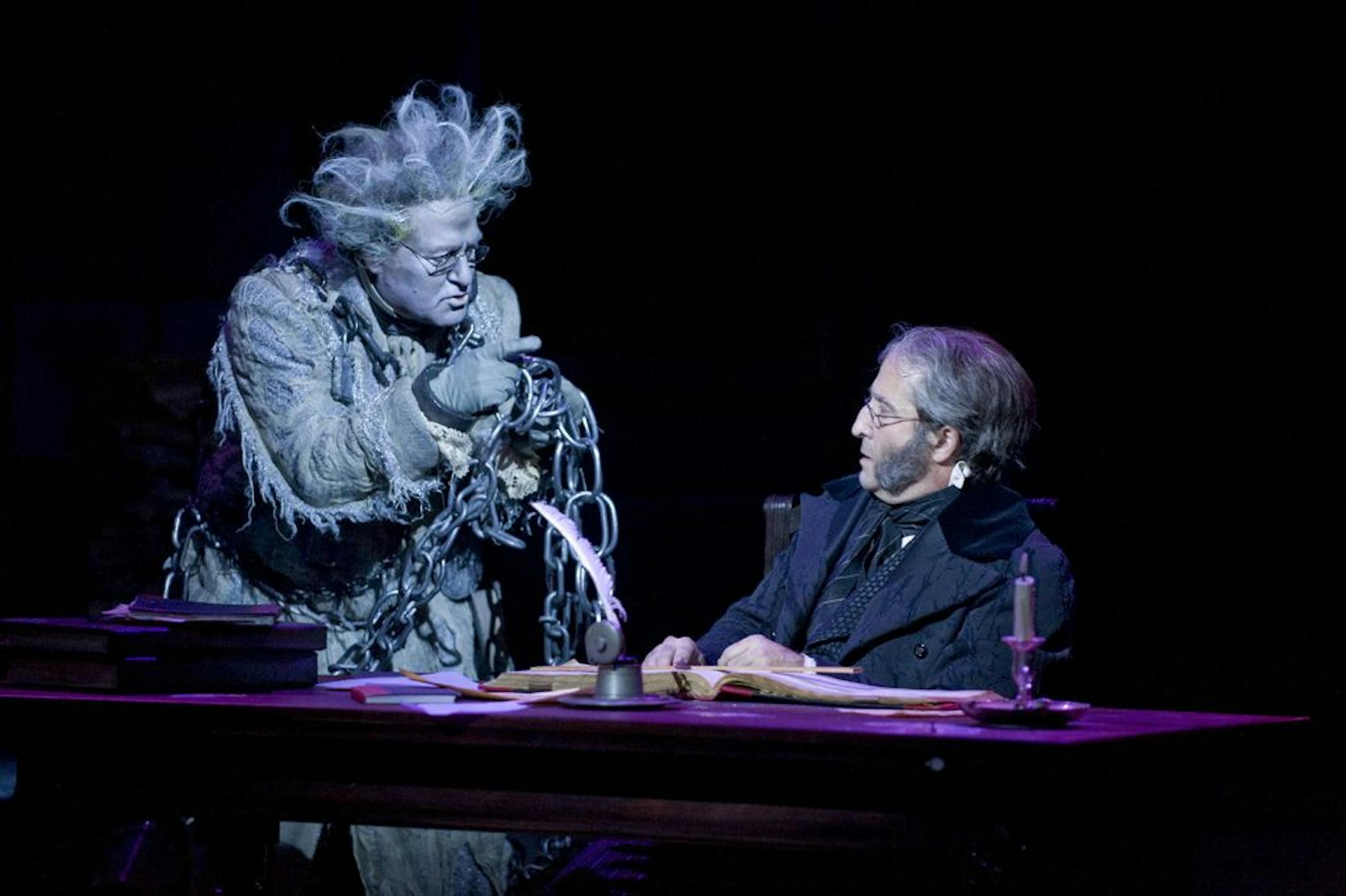 Photo by Michael Brosilow Bob Davis (Jacob Marley) and J.C. Cutler (Ebenezer Scrooge) in the Guthrie Theater's production of the Charles Dickens classic A Christmas Carol.