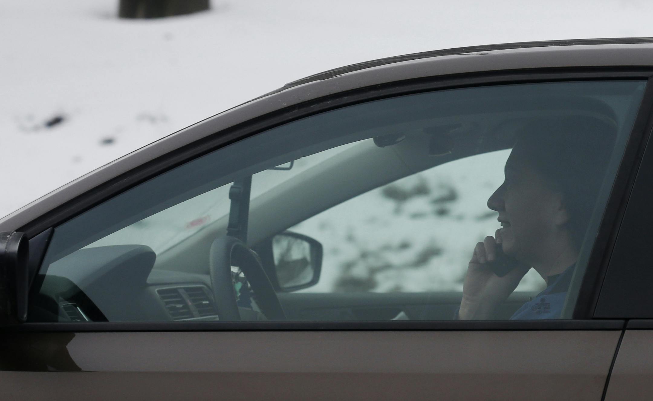 FILE - In this Dec. 19, 2013 photo, a motorist talks on a cell phone while driving on an expressway in Chicago. A sophisticated, real-world study confirms that dialing, texting or reaching for a cellphone while driving raises the risk of a crash or near-miss, especially for younger drivers. But the research also states that simply talking on the phone did not prove dangerous, as it has in other studies. (AP Photo/Nam Y. Huh)