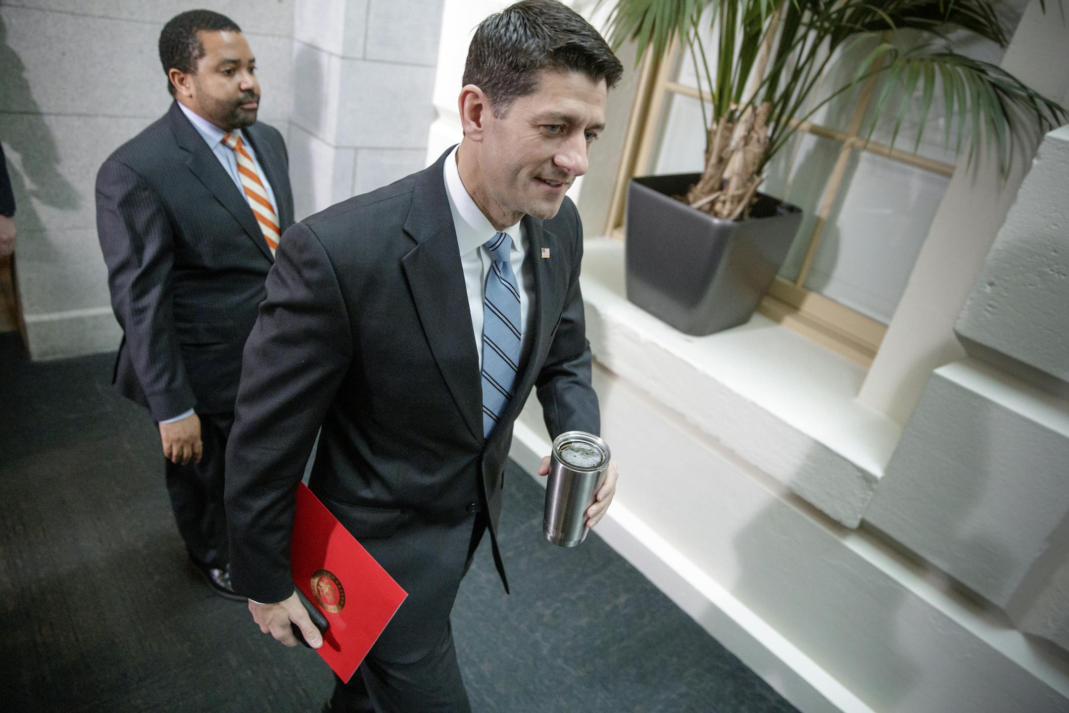 House Speaker Paul Ryan, R-Wis., arrives as President Donald Trump comes to the Capitol to rally support for the Republican health care overhaul by taking his case directly to GOP lawmakers two days before the House plans a climactic vote that poses an important early test for his presidency, in Washington, Tuesday, March 21, 2017. (AP Photo/J. Scott Applewhite)