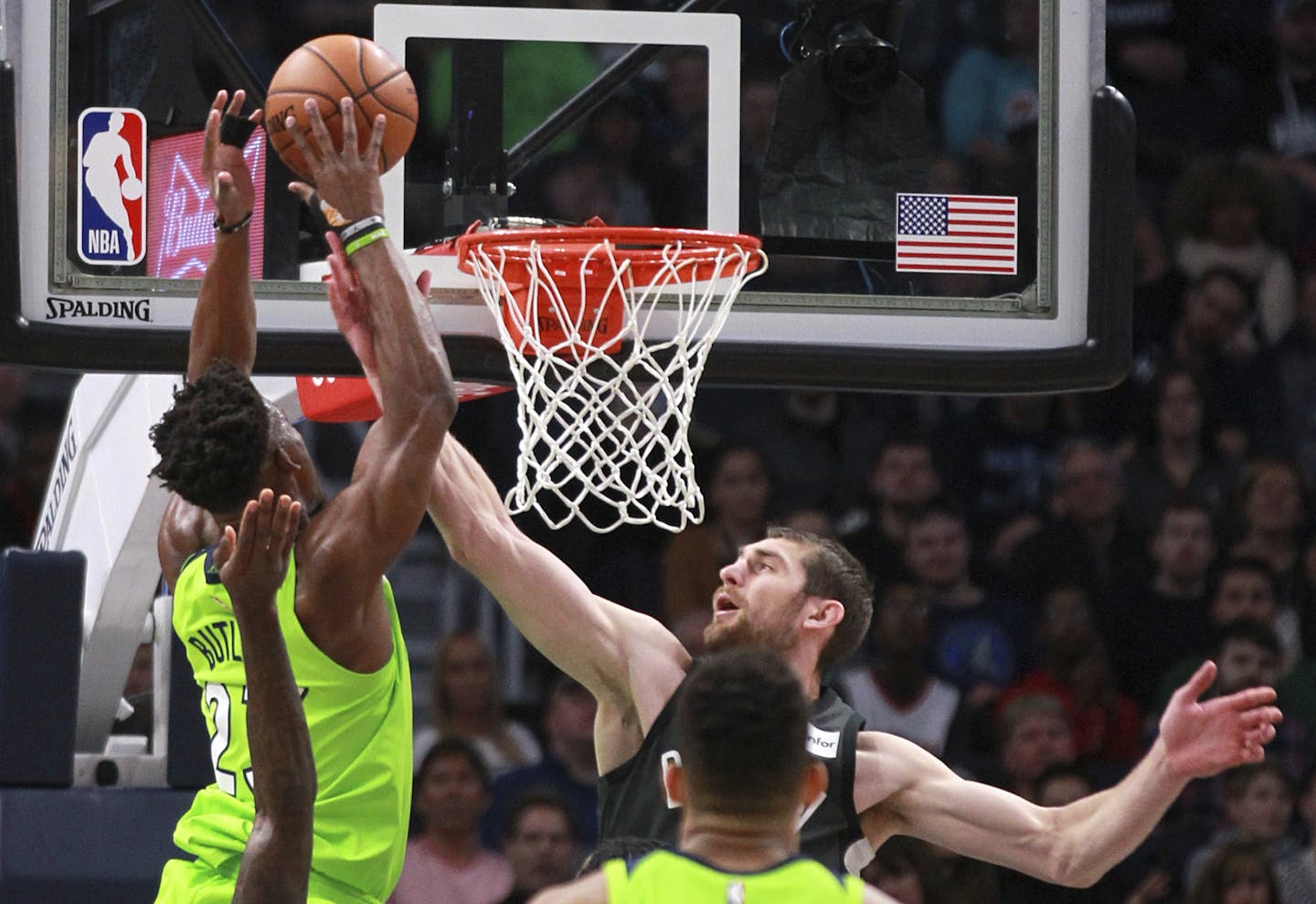 Brooklyn Nets center Tyler Zeller (44) fouls Minnesota Timberwolves guard Jimmy Butler (23) in the first quarter of an NBA basketball game Saturday, J