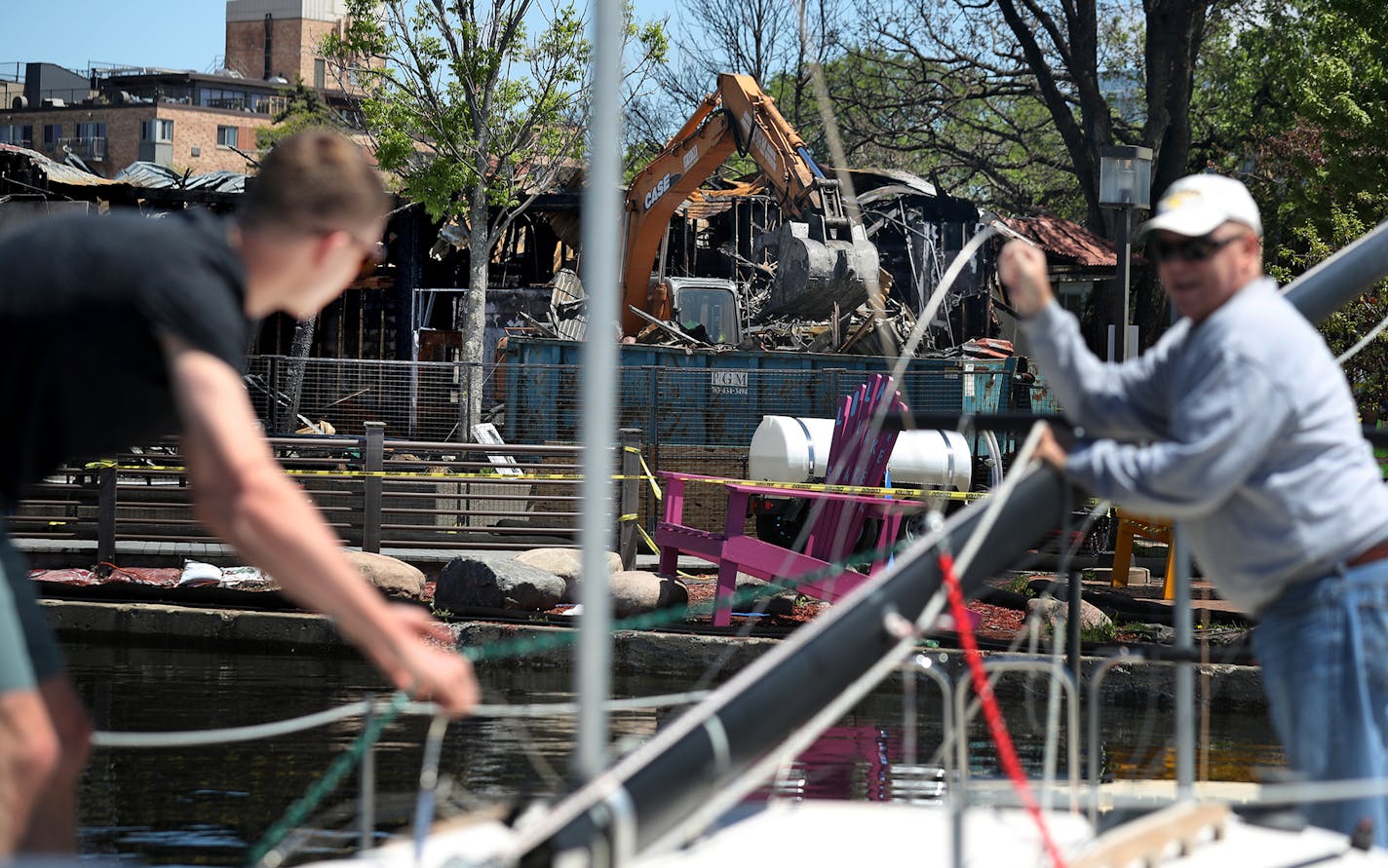 Fran Fagerstrom, right, prepares to launch his 23 foot sailboat with the help of his son Erik as an excavator tears down the remnants of Lola on the Lake at the pavilion at Bde Maka Ska/Lake Calhoun, damaged beyond repair during a recent fire and seen Tuesday, May 28, 2019, in Minneapolis, MN.] DAVID JOLES &#x2022; david.joles@startribune.com Minnehaha Creek is flooding near Penn Av. and 54th street, which has uprooted trees in some areas. The Minnehaha Creek Watershed District website said the