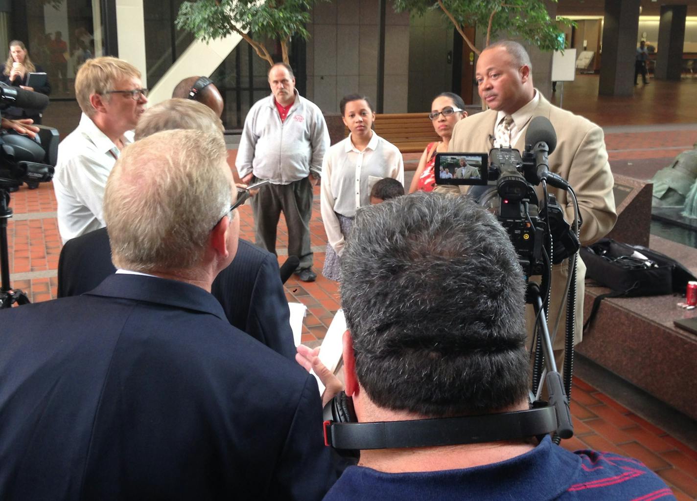 Minneapolis Deputy Police Chief Ed Frizell, at right, announces his campaign for Hennepin County Sheriff on July 16, 2014, at the Hennepin County Government Center.