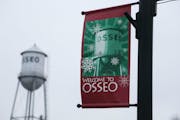 A holiday banner is seen along Central Avenue in downtown Osseo on Dec. 18, 2014.