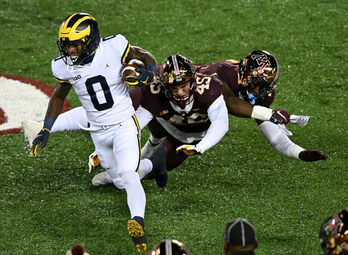 Gophers defensive lineman MJ Anderson (3) and linebacker Cody Lindenberg (45) collided as they missed a tackle against Michigan Wolverines wide receiver Giles Jackson last week.